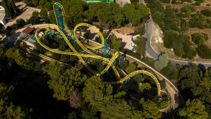 Aerial view of yellow roller coaster.