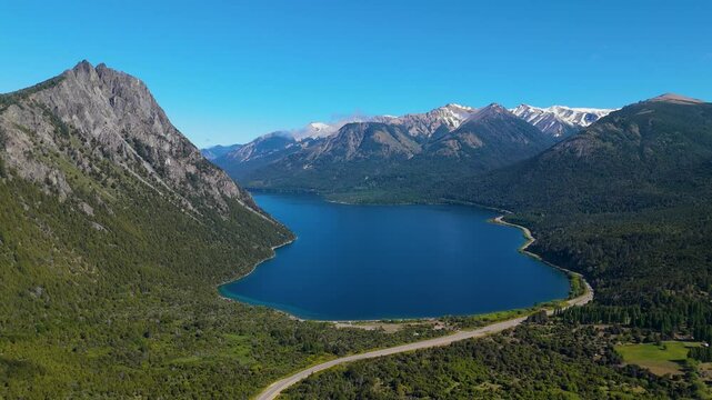 Aerial view of Brazo Huemul, featuring the majestic Cerro Tres Monjes, Route 40, and the pristine waters of Lake Nahuel Huapi , Villa La Angostura, Patagonia, Argentina