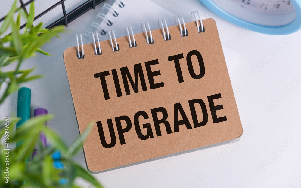 Poster a brown notebook with the words time to upgrade written on it