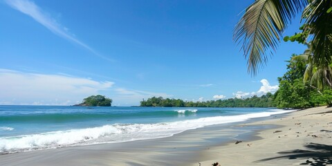 Fototapeta premium Tranquil beach with soft waves rolling in, surrounded by vibrant greenery on a sunny day