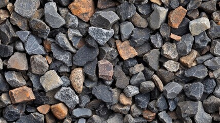 Naklejka premium Close-up of a collection of various sized grey and brown rocks