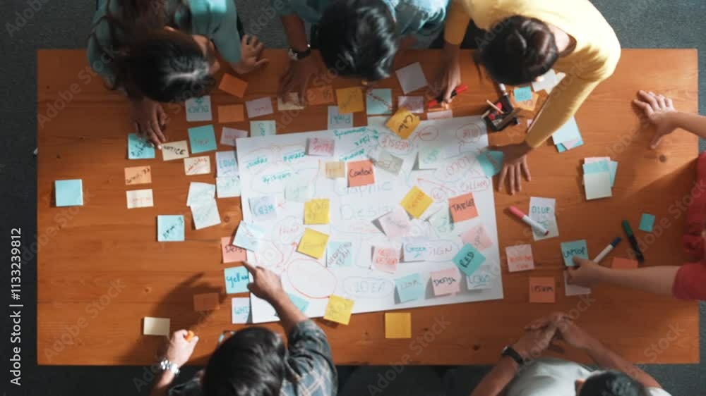 Poster top view of project manager writing and sticking stick notes. aerial view of professional business p