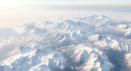 Fototapeta premium Snowy mountains surrounded by clouds, winter background