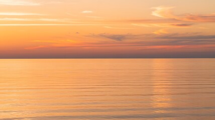 Vibrant Golden Sunset Over Tranquil Sea with Colorful Sky and Gentle Waves in Coastal Landscape