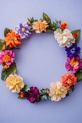 Fototapeta premium A circle of pastel-colored flowers creating a beautiful frame on a light purple background, leaving room for text in the center.