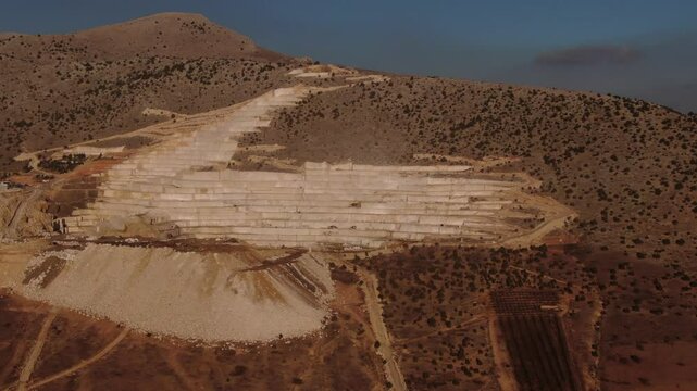 Aerial panorama of marble quarries in Burdur, Turkey. Marble quarry top view. Marble quarry in high altitude mountains. Aerial panorama over Burdur marble quarry.