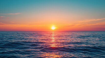 Fototapeta premium Serene Sunset Over Tranquil Ocean Waves with Vivid Colors Illuminating the Horizon in a Relaxing Coastal Environment