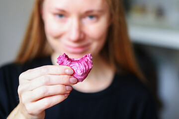 girl eat homemade zephyr. Homemade marshmallows. A woman puts a ready-made zephyr