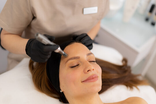 Revitalizing skin treatment with microneedling and mesotherapy technique in a serene spa environment