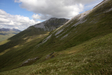 Fototapeta premium Ascent path to Binnein Mor and Na Gruagaichean - View towards Glen Nevis and water of Nevis valley - Mamores - Highlands - Scotland - UK