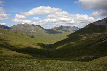 Fototapeta premium Ascent path to Binnein Mor and Na Gruagaichean - View towards Glen Nevis and water of Nevis valley - Mamores - Highlands - Scotland - UK