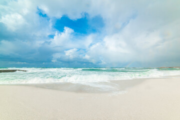 Fototapeta premium Huge clouds over Is Arutas beach on a winter day