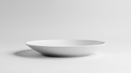Minimalist White Ceramic Plate on Soft Gray Background, Perfect for Food Photography, Table Settings, and Restaurant Design Concepts