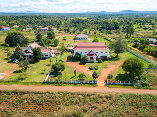 Tranquility in the Countryside: An aerial view of a charming countryside retreat, featuring...