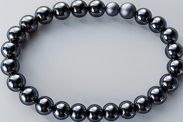 Obraz premium Black pearl bracelet arranged in circular shape on light background. Minimalist jewelry design concept for luxury fashion, accessories, and decorative banners