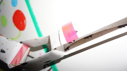 Close-Up of Paper Garland and Child’s Holiday Art