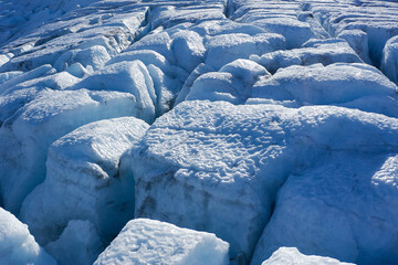 Experience the stunning beauty of Glacier Ice Patterns displayed in captivating shades of blue