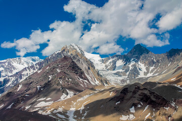 San Jose Volcano mountain in the Andes, Chile. Chilean Andes peak with snow, ice and glacier near to Santiago de Chile, Cajon del Maipo. Volcanic mountain slopes and summit in the Andes