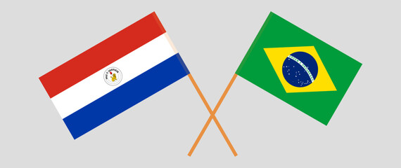 Crossed flags of Republic of Paraguay and Brazil. Official colors. Correct proportion. Vector illustration