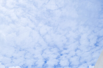 Altocumulus clouds on blue sky background with modern Home with Elements of architecture of buildings,sunny and Large Sheep Clouds,copy space.