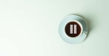 Fototapeta premium Cup of coffee with a pause sign, wake up in the morning, hot drink with caffeine, take a break, positive attitude