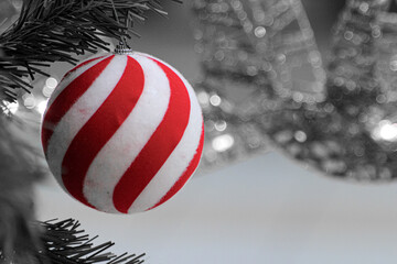 red and white christmas bauble on black and white background 