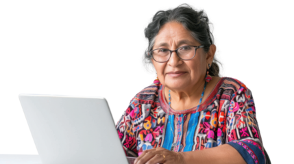 Mexican senior female Employee IT specialist sit at work with laptop on white background