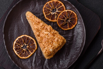 Piece of sweet layer cake Napoleon with custard