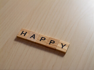 Celebrating joy happy letters a wooden table indoor setting close-up view positive vibes