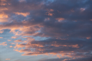 Sunset sky background. Beautiful evening sunset sky with clouds.