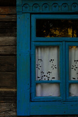 Charming Whispers Behind a Blue Window