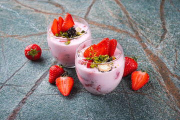 cream cheese dessert with mascarpone cream, vanilla curd with fresh strawberries and green...