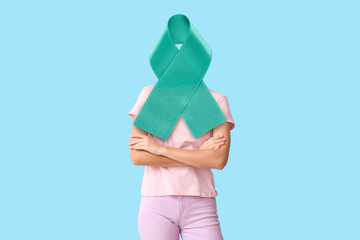 Pretty young woman in stylish t-shirt on blue background