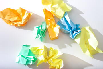 colorful crumpled paper on white underground