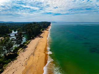 Fototapeta premium Aerial view of blue sea surface water texture background,Amazing sun reflections Aerial flying drone view Waves water surface texture on sunny tropical ocean