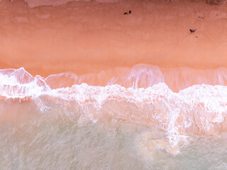 Amazing Top view colorful pink sand beach landscape background,Summer sea waves crashing on sandy shore seascape background,High angle view ocean nature beach background
