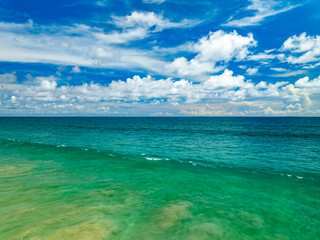 Aerial view of blue sea surface water texture background,Amazing sun reflections Aerial flying drone view Waves water surface texture on sunny tropical ocean