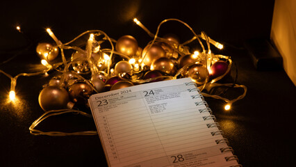 almanac unfolded on Christmas Eve with christmas decorations