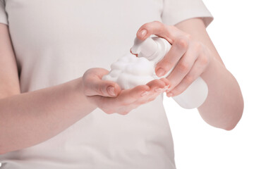 Fototapeta premium Woman applying cleansing foam onto hand on white background, closeup