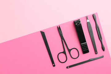 Set of pedicure tools on color background, flat lay. Space for text