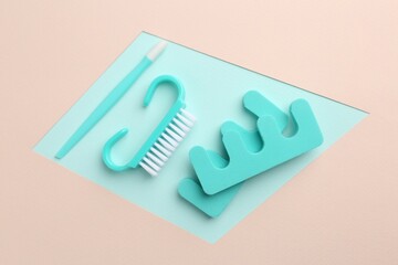 Set of pedicure tools on color background, flat lay