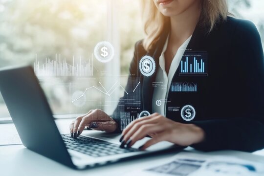 Businesswoman works on laptop visualizing cost reduction strategies. Digital graphic overlays show financial data, dollar symbols. Tech savvy woman plans resources efficiency for corporate business.