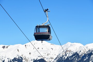 Vintage Ski gondola over the slopes of Courchevel ski resort, French alps © raeva