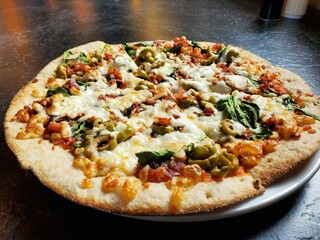 Fresh Wood Oven Pizza With Green Olives, Mushrooms, and Spinach