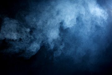 Blue/Grey Hazy smoke and fog on a black background