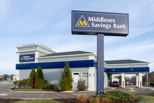 A Middlesex Savings Bank pole sign with the blue sky background. Massachusetts, USA, on November 10, 2023. Middlesex Savings Bank is an American mutual bank. 