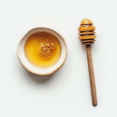 Honey, honeycomb, dipper on white.