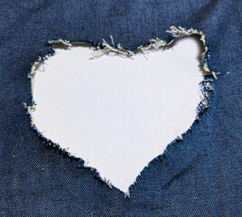 the heart forms an opening in the blue denim.