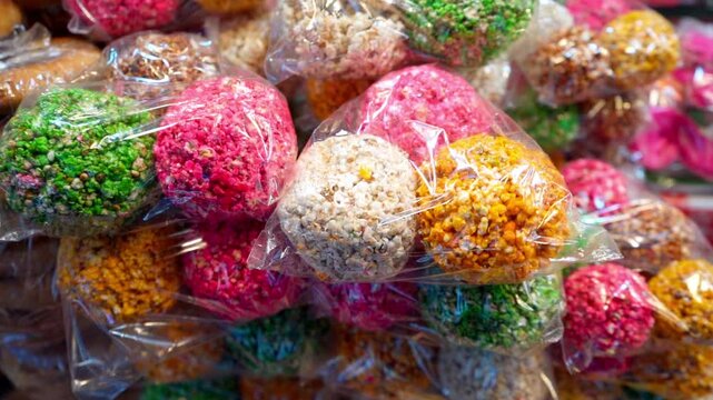 A typical sweet in a colorful ball, also called El Alboroto with popcorn and sugar