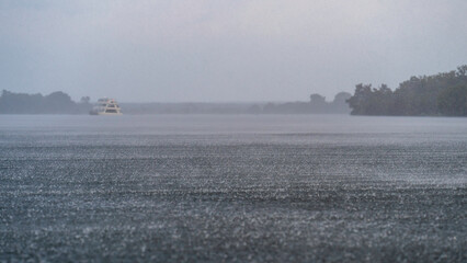 Heavy rain falling on the Zambezi River, Livingstone, Zambia